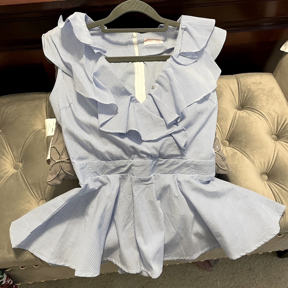 Sleeveless blue and white summer blouse size small.